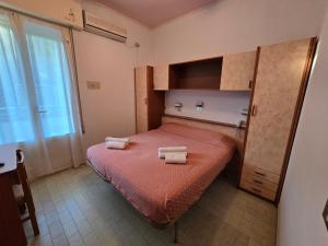 Postel nebo postele na pokoji v ubytování Hotel Rosa