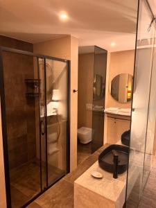a bathroom with a shower and a sink at Hotel Pljevlja in Pljevlja +55 photos