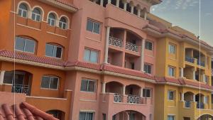 a tall building with many windows and balconies at ستوديو بورتو شرم الشيخ in Sharm El Sheikh