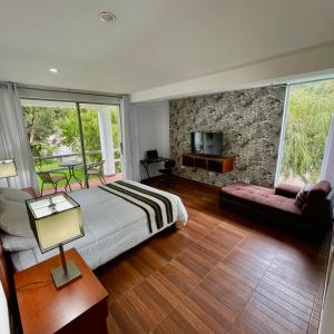 En eller flere senge i et værelse på Balcones del Río Calca Casa de campo