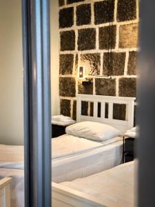 Postel nebo postele na pokoji v ubytování Tiroents Hotel