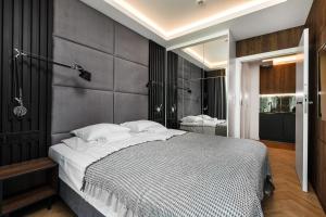 Postel nebo postele na pokoji v ubytování Baltic Amber Apartment + 9 fotografií