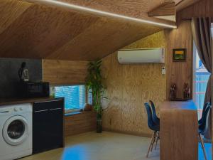 a laundry room with a washing machine and a window at Seagull Studio Byala in Byala +4 photos