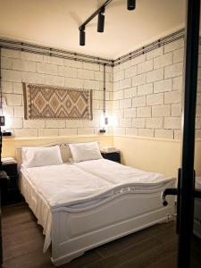 Postel nebo postele na pokoji v ubytování Tiroents Hotel