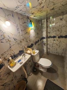 a bathroom with a toilet and a sink at Riad Bennouna in Fez +27 photos