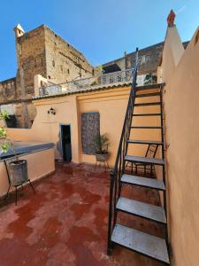 a staircase in the courtyard of a building at Riad Bennouna in Fez
