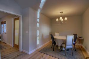 a dining room with a table and chairs at Bridge Street Beauty in Cambria +11 photos