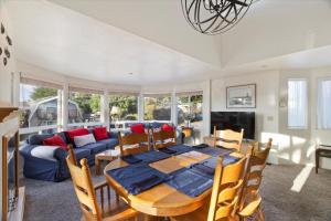 a dining room with a table and a couch at Casa De Marina in Cambria