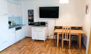 Kuchyňa alebo kuchynka v ubytovaní Apartments AM SEE