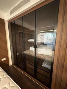 a reflection of a glass window of a bedroom at Grand Sapphire Resort & Casino in Phikardhou +28 photos