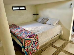 Una cama o camas en una habitación de Lazy Búngalow