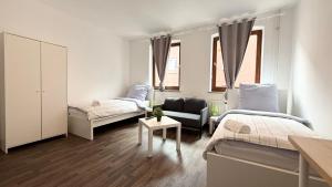 Postel nebo postele na pokoji v ubytování Apartments für Firmen & Monteure Zentral in Kiel
