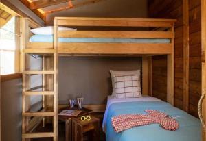 a bedroom with a bunk bed with a ladder at Camping 4 étoiles - Piscine - cbgcb0b in Saint-Jean-de-Monts +97 photos