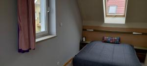 Voodi või voodid majutusasutuse Sea House in Puck Free Parking toas