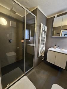 a bathroom with a shower and a sink at Sweet Pisa Guesthouse in Pisa +23 photos