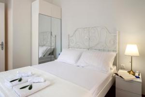 Giường trong phòng chung tại Anastasia Gardens House