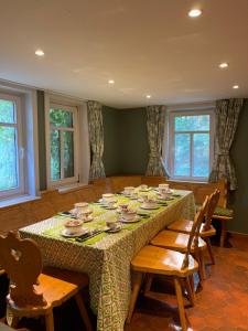 a dining room with a table with dishes on it at Historische Mühle am Schloss in Amöneburg