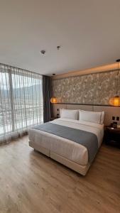 Postel nebo postele na pokoji v ubytování Sonesta Hotel Ibagué