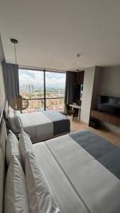 Postel nebo postele na pokoji v ubytování Sonesta Hotel Ibagué