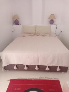 Postel nebo postele na pokoji v ubytování Riad Dar Lilas