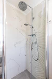 a bathroom with a shower with a glass door at House Punat Residence in Punat +34 photos