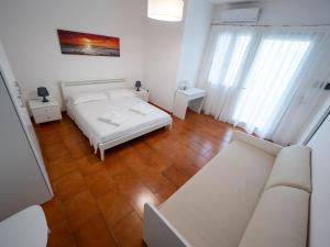 Postel nebo postele na pokoji v ubytování Torre del Salento