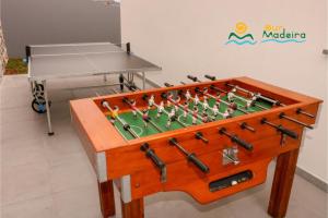 a foosball table with a board and tools on it at OurMadeira - CalhetaScape, informal in Calheta