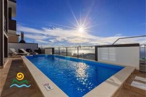 a swimming pool on the roof of a house at OurMadeira - Casa da Belita, sea-view in Calheta