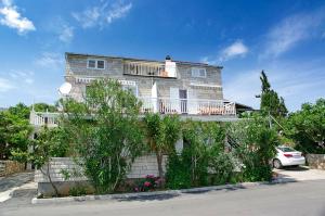 a large house with a car parked in front of it at Foissner Apartments in Zavalatica