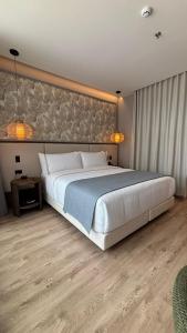 Postel nebo postele na pokoji v ubytování Sonesta Hotel Ibagué