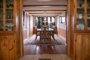 a dining room with a table and chairs at Keuka Sunrise 