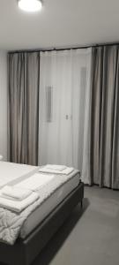 Postel nebo postele na pokoji v ubytování Neranxi Apartament