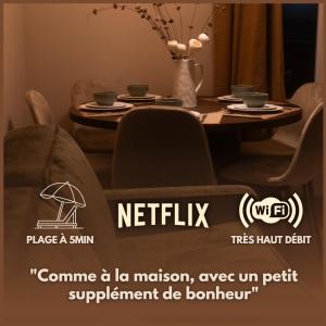 セリニャンにあるLe Japandi - appartement cosy & friendlyのテーブルと椅子、そしてダイニングルーム