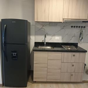 Η κουζίνα ή μικρή κουζίνα στο Torre Ventto Loft 24-7 +7 φωτογραφίες