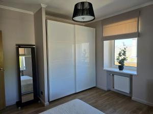 Ένα ή περισσότερα κρεβάτια σε δωμάτιο στο Seaside Park Apartment