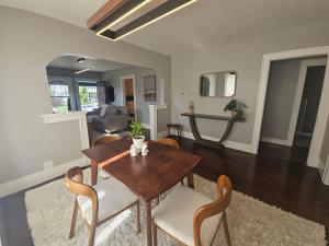 a dining room and living room with a table and chairs at The Chelsea in Dayton