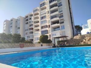 a swimming pool in front of a building at De la Montaña al Mar in Almería
