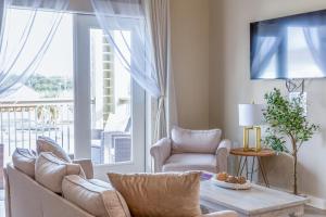 a living room with a couch and a table at Hotel Whiskey in Pascagoula in Pascagoula