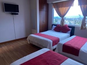 Postel nebo postele na pokoji v ubytování Hotel Versailles