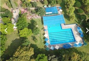 an overhead view of a building with a swimming pool at פינה למרגלות הגלבוע in Bet Alfa