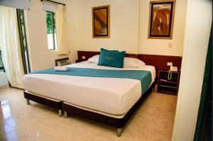 Postel nebo postele na pokoji v ubytování Hotel Monchuelo Spa