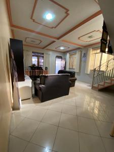 a living room with a couch and a table at Casa Bio - Your place in COP 30 - Completa in Belém +24 photos