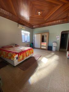 a bedroom with a bed and a wooden ceiling at Casa Bio - Your place in COP 30 - Completa in Belém