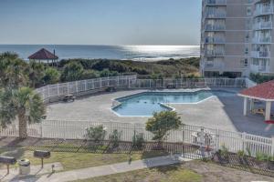 a view of a swimming pool and the beach at St. Regis 3105 - Adorable Oceanfront Condo in Chadwick Acres +33 photos