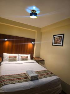 Voodi või voodid majutusasutuse Alegria s House Cusco toas