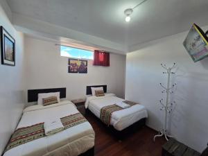Voodi või voodid majutusasutuse Alegria s House Cusco toas