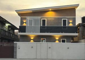 a large building with lights on top of it at Ethan Apartments in Yaba