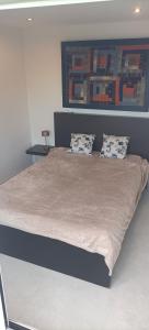 Giường trong phòng chung tại Maison vue mer a 5 min de MONACO