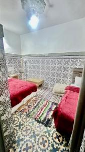 Postel nebo postele na pokoji v ubytování Riad Dar Lokman