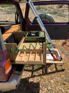 a table in the back of a truck at Σκηνή Οροφής 4χ4 όχημα in Megalochori +7 photos